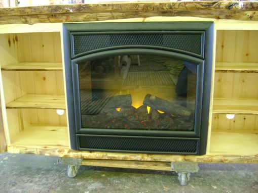 Custom Made Aspen Log Tv Stand With A Built In Electric Fire Place